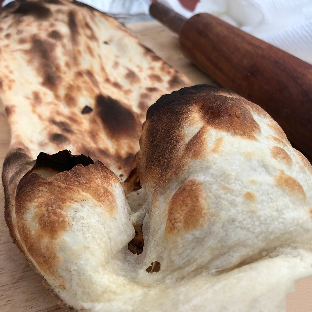 Fresh baked Naan cooked in a GULATI Home Tandoor